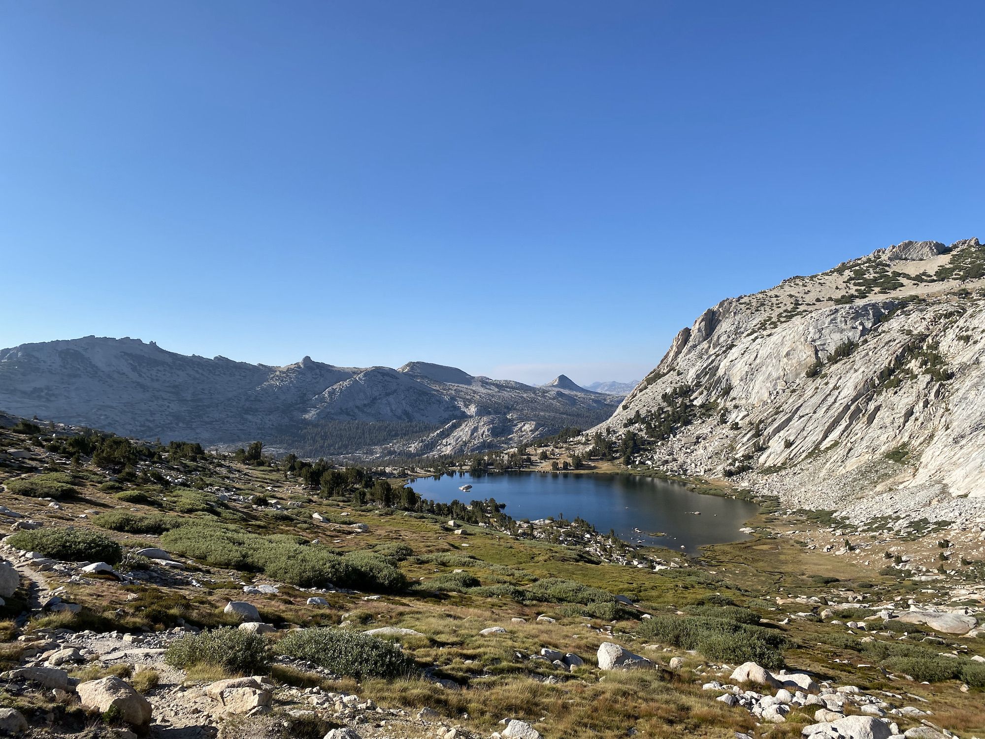 A lake nestled between mountains.