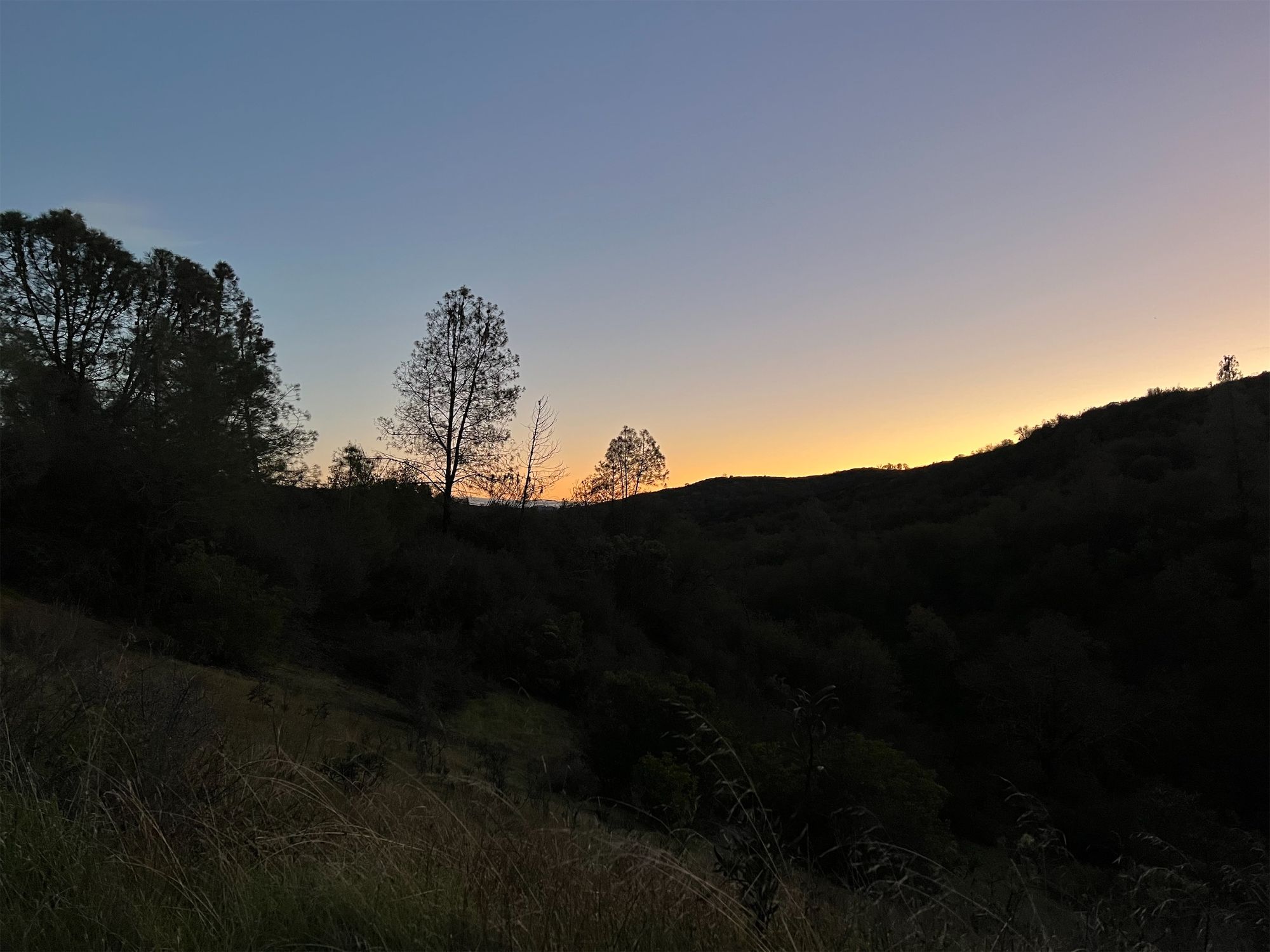 Mountain silhouette in late dusk light.