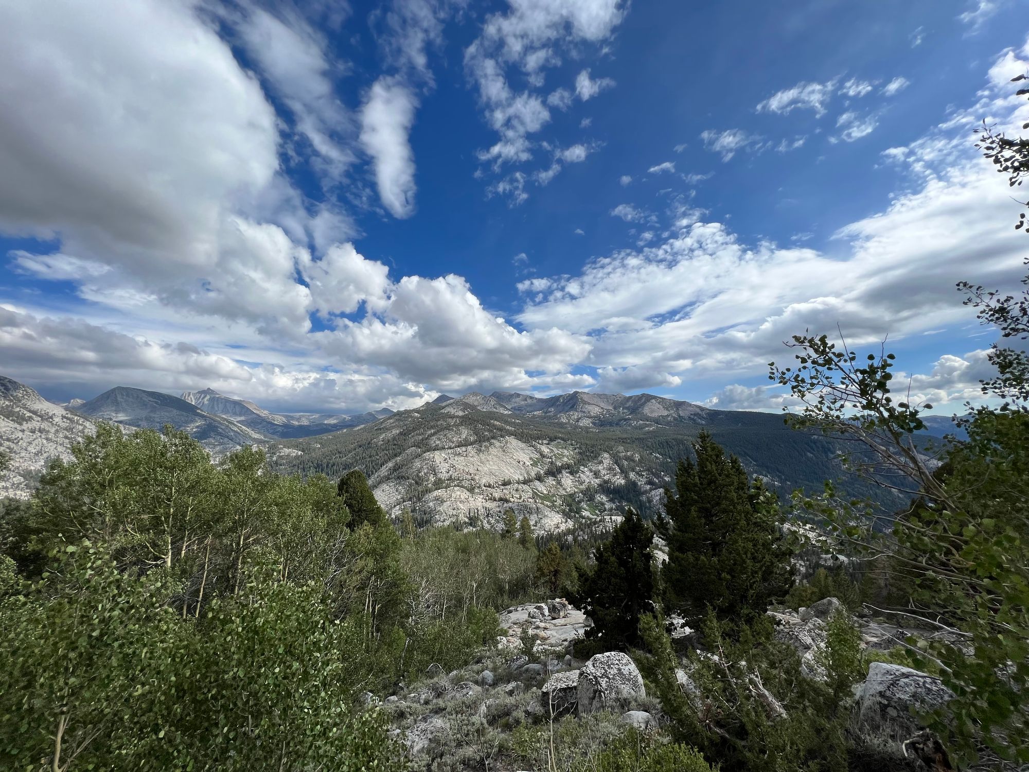 An open mountain vista with mostly blue skies.