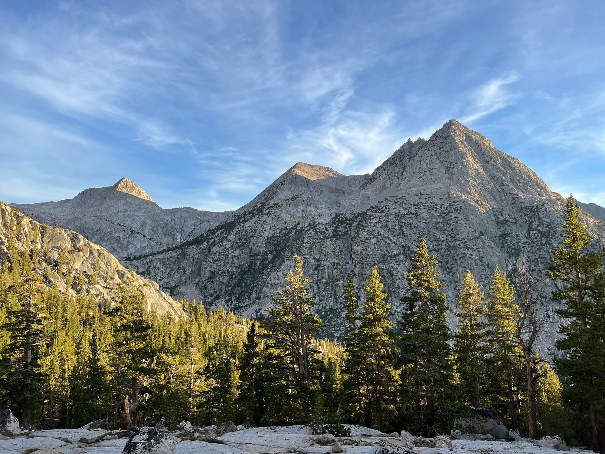 A mountain chain. Only the tops are illuminated by the sun.