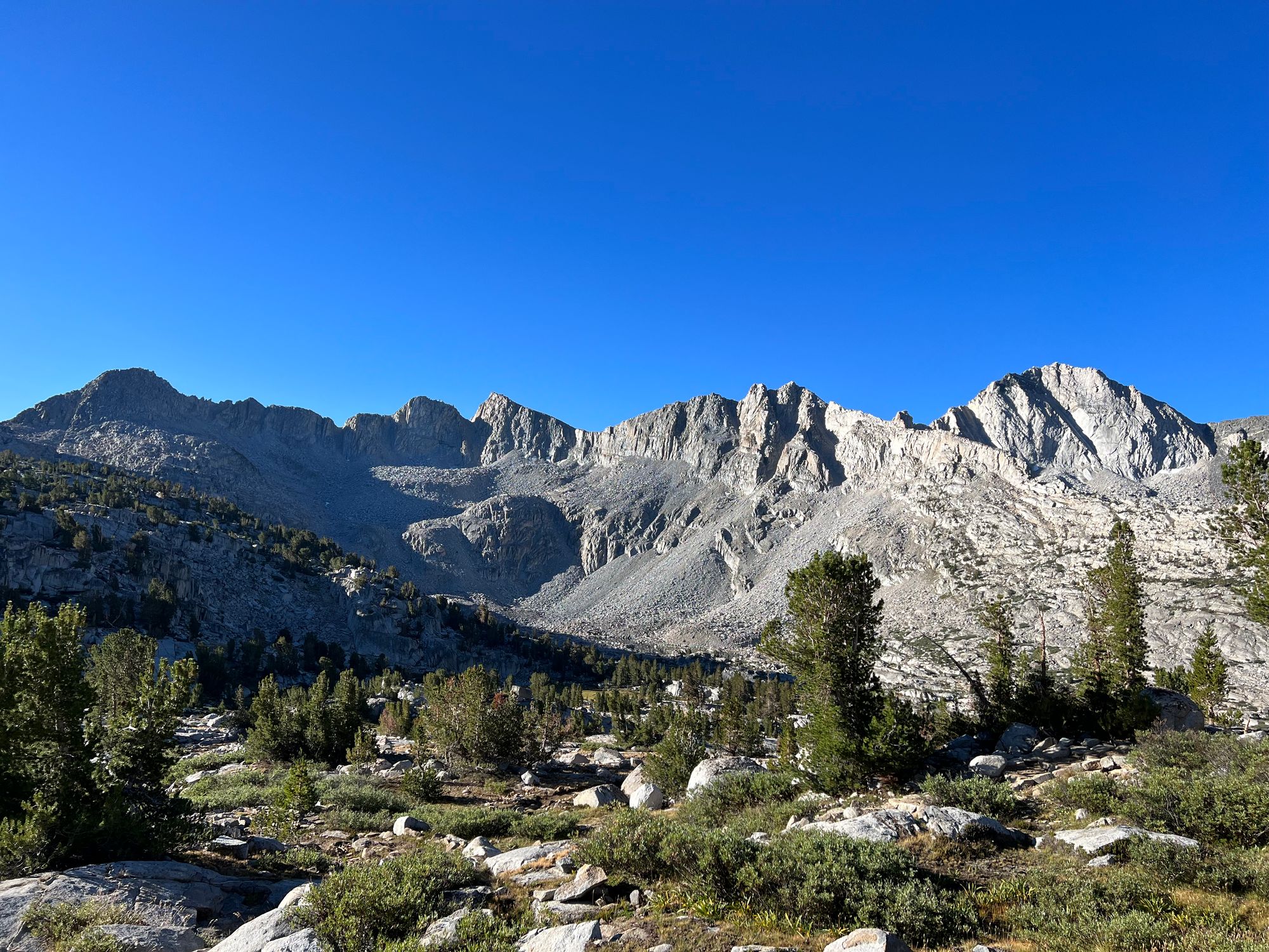 A wall of rugged mountains.