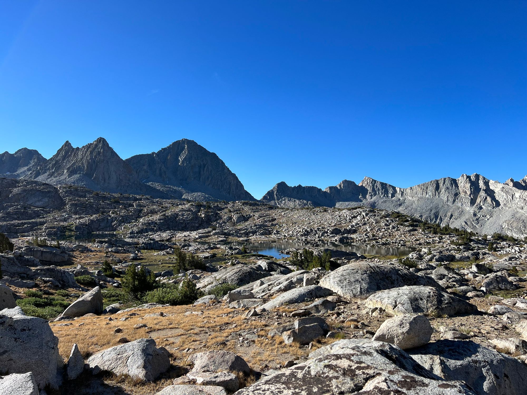 Two small lakes nestled in a rocky landscape.