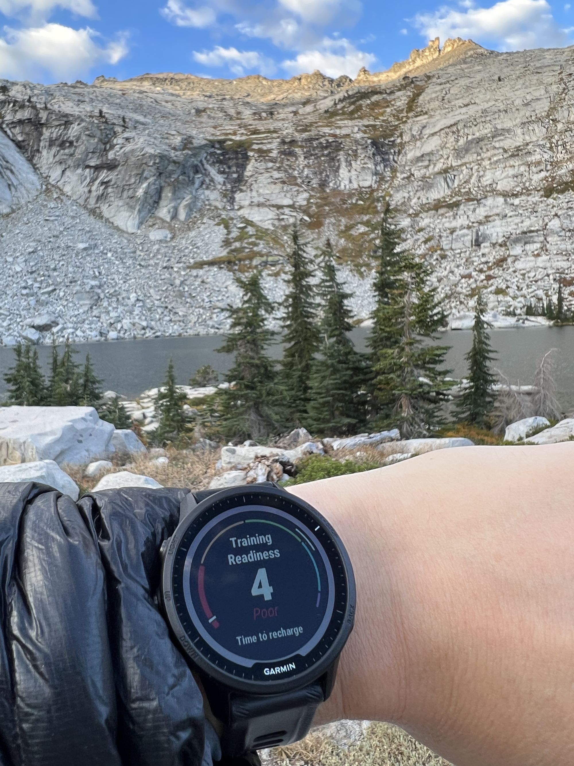 A Garmin watch showing a Training Readiness score of 4/100.