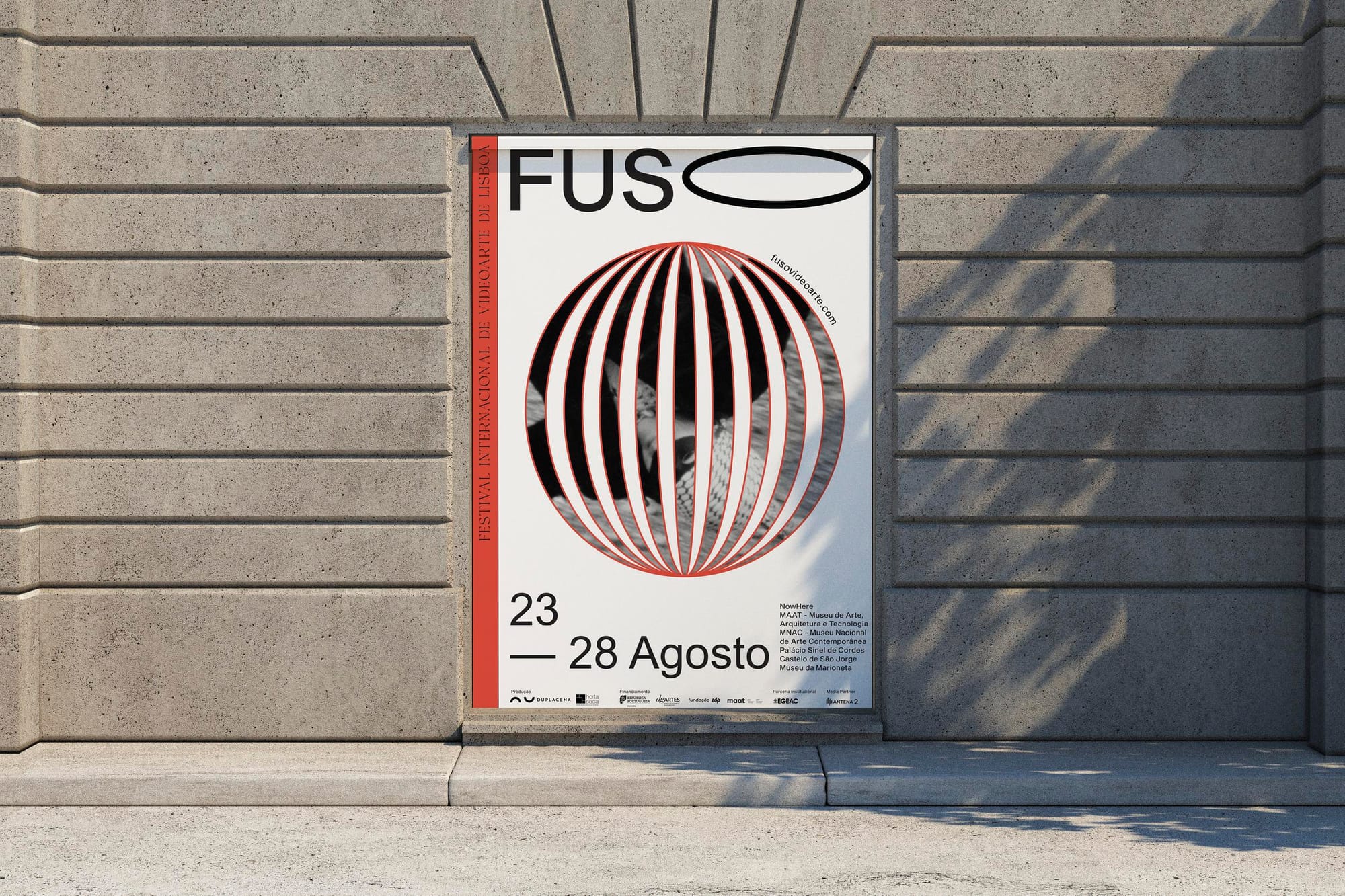 A poster for the festival FUSO on a plain concrete wall.