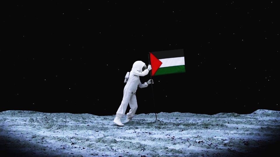 An astronaut walking on the moon and planting the Palestinian national flag. 