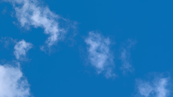 Photo of clouds shows how using Dr. John Sarno’s approach dissipates pain to reduce the risk of undertaking back surgery.