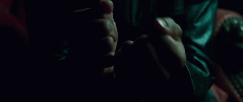 Morpheus in the leather chair, palms open, red pill in the right hand, blue in the left. Neo has not decided anything yet. The room is already the room.