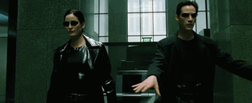 The famous lobby scene. Bullets. Marble columns. Long coats. Slow motion.