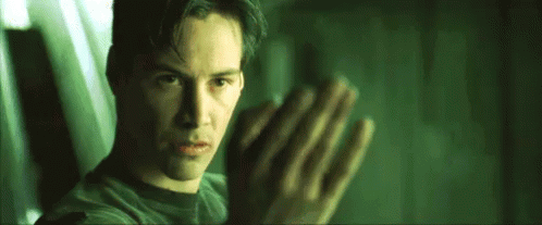 Neo faces Agent Smith on the subway platform. Morpheus is somewhere else. Morpheus is not in this shot.