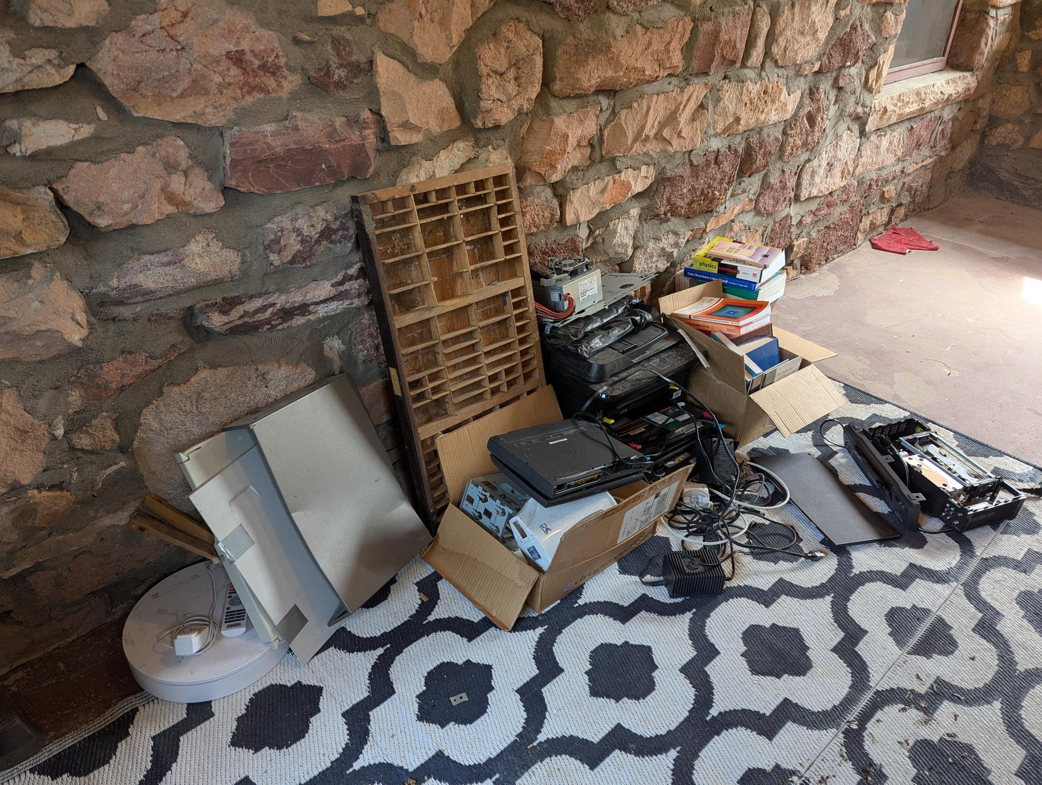 A pile of stuff on the porch of the MAL