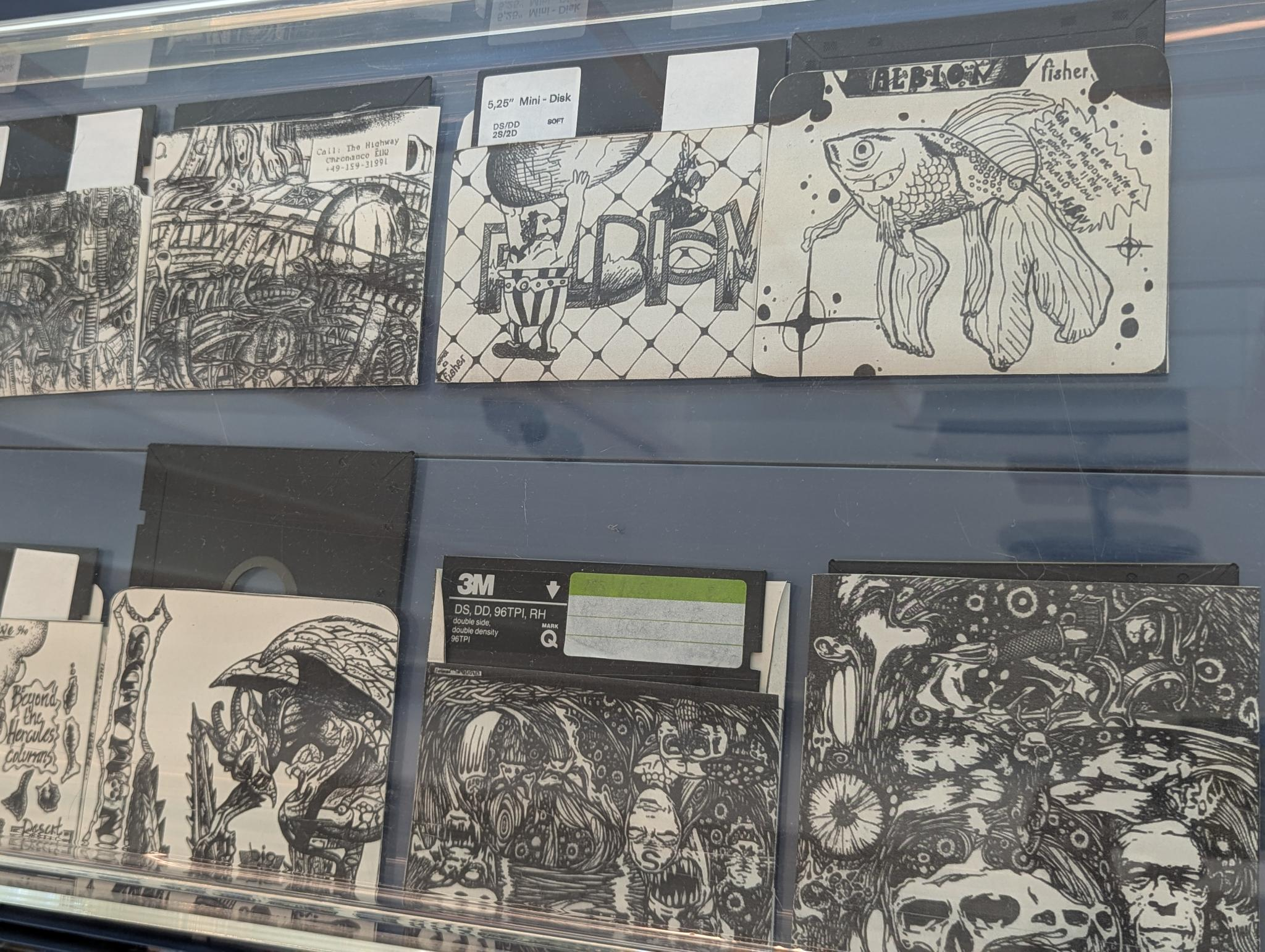 hand-decorated floppy disk sleeves, with elaborate ink drawings