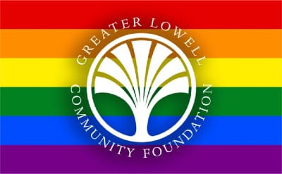 Rainbow flag behind the Greater Lowell Community Foundation logo
