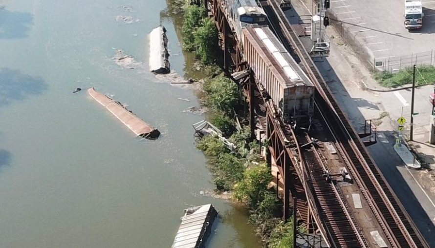 Freight train derails into the canal along Capital Trail at Dock Street