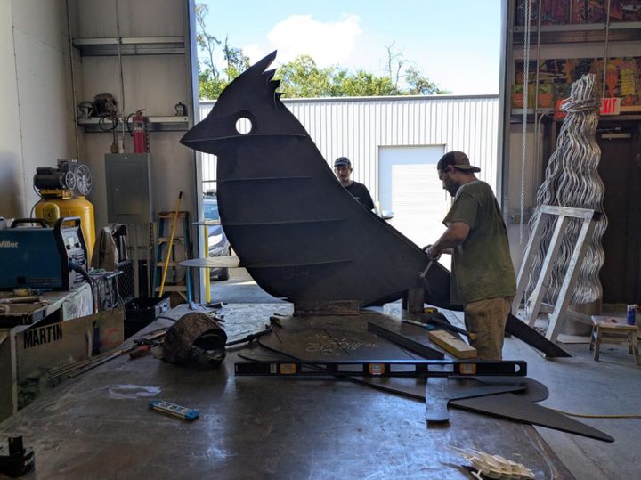 A giant cardinal sculpture is headed for a dead-end street near Lamplighter