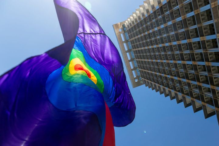 Photos: Officials raise pride flag in City Hall ceremony