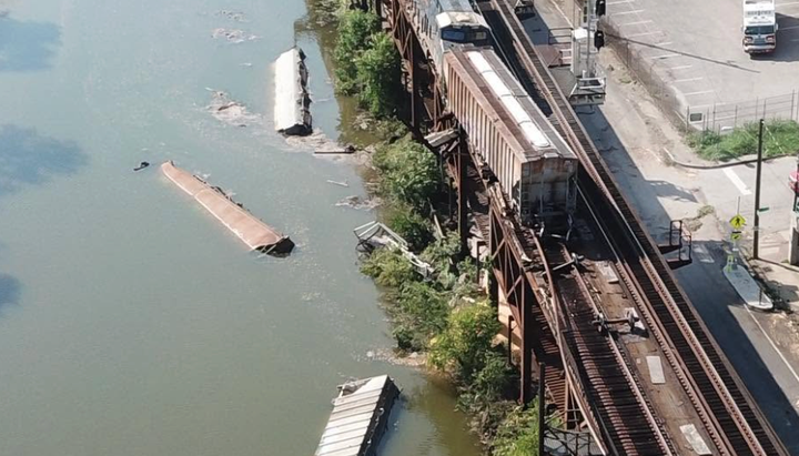 Freight train derails into the canal along Capital Trail at Dock Street