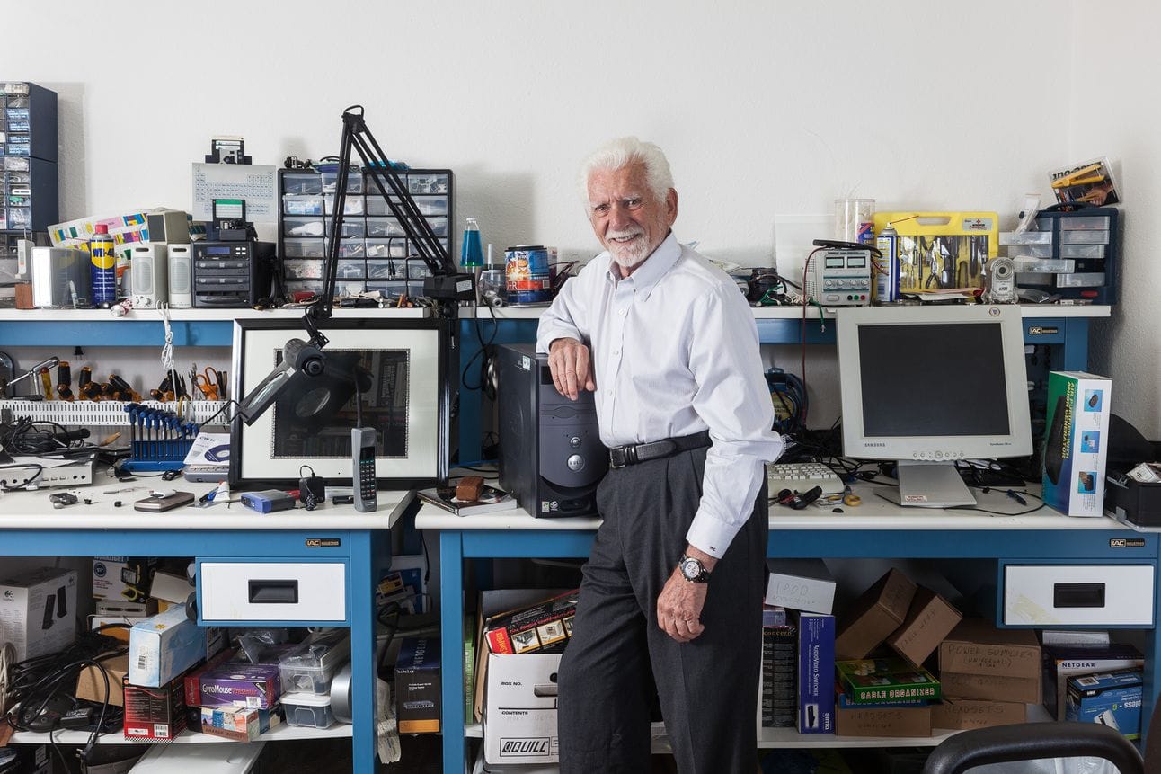 I love photos like this where you don’t even notice some of the little details at first. Like, is that a lava lamp behind the spindle of CD+Rs over his shoulder?