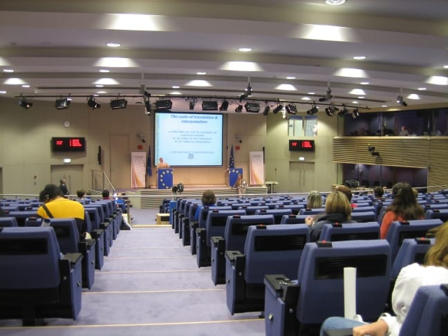The Berlaymont press room in Brussels, where the European Commission and AI Office announce implementation guidance for the AI Act.