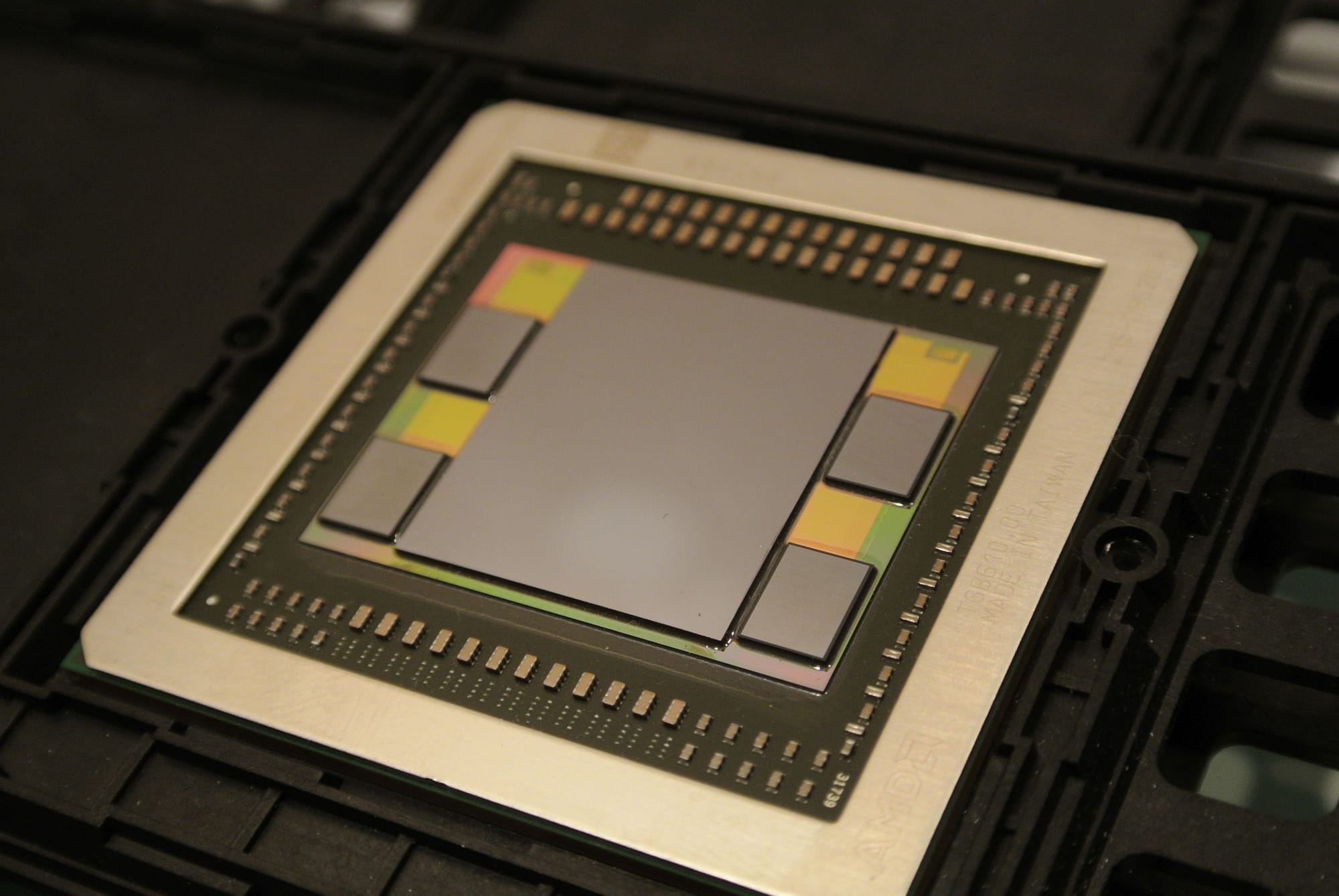 AMD Fiji GPU package: a single rectangle containing the GPU compute die, four HBM stacks, and the interposer that wires them together. Fiji was the first GPU to ship with HBM in 2015.