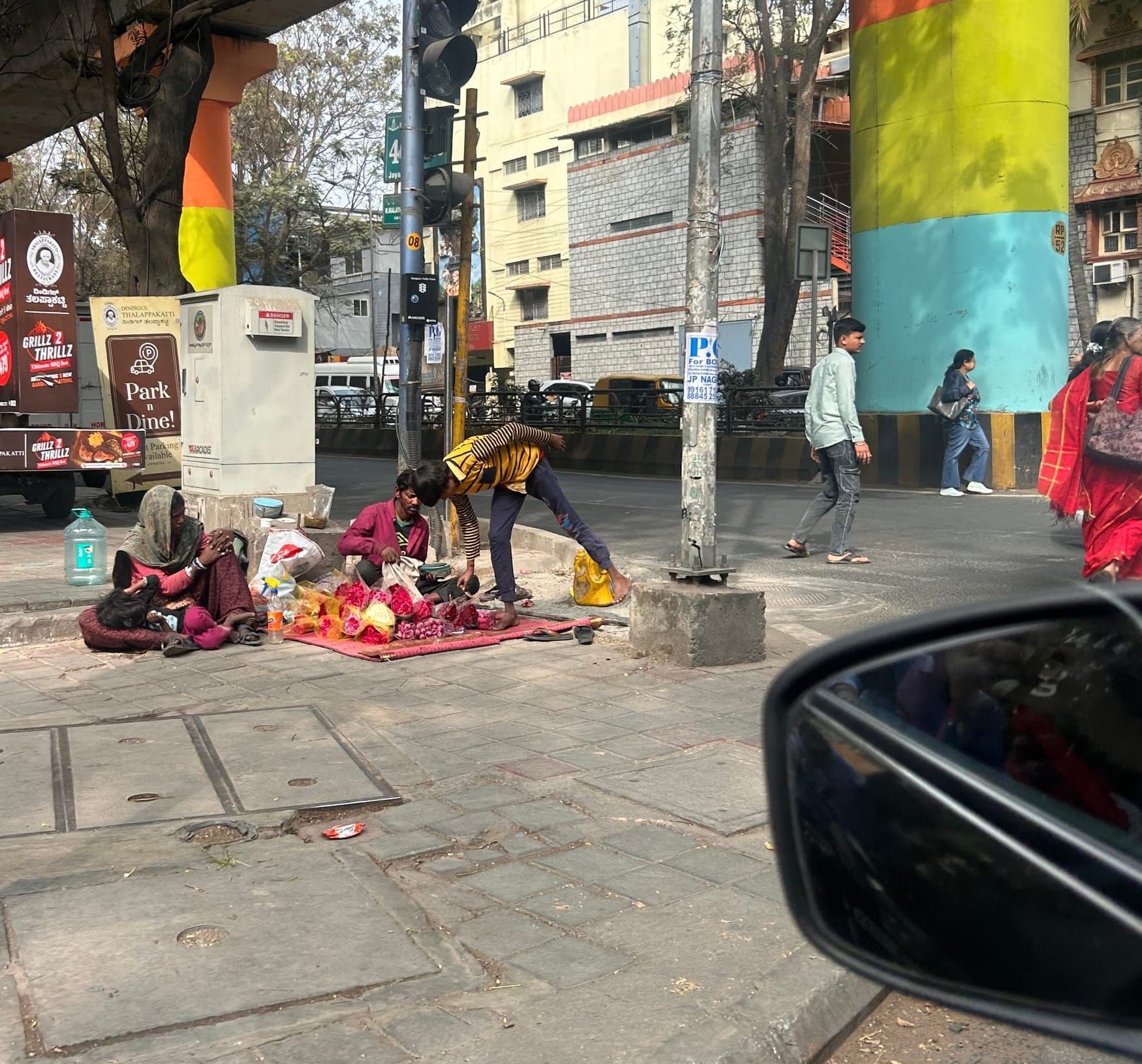 At a Traffic Signal, I Saw Motherhood