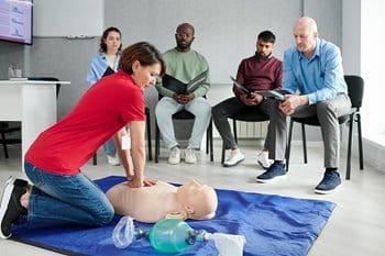 Adults taking CPR lessons