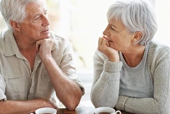 Elderly man and woman talking