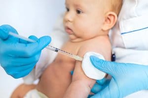 Infant getting vaccine