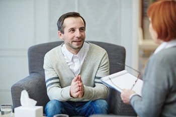 Man talking to behavioral health specialist