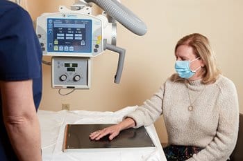 Orthopedic doctor examining patient's wrist