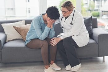 Mental health therapist with patient