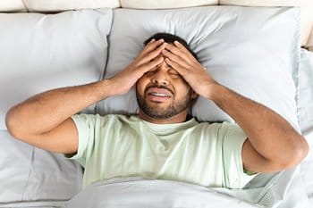 Tired person that can't fall asleep