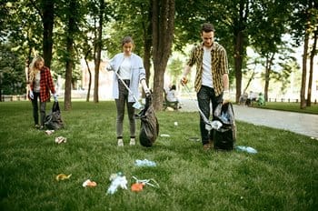 Group of people picking up litter