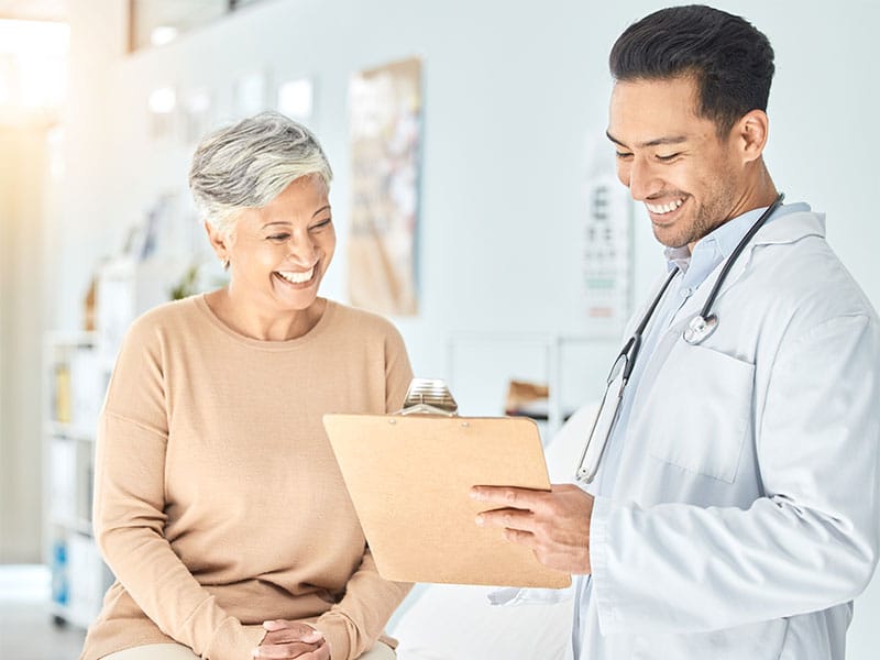 Doctor consulting with a senior patient in a primary care clinic
