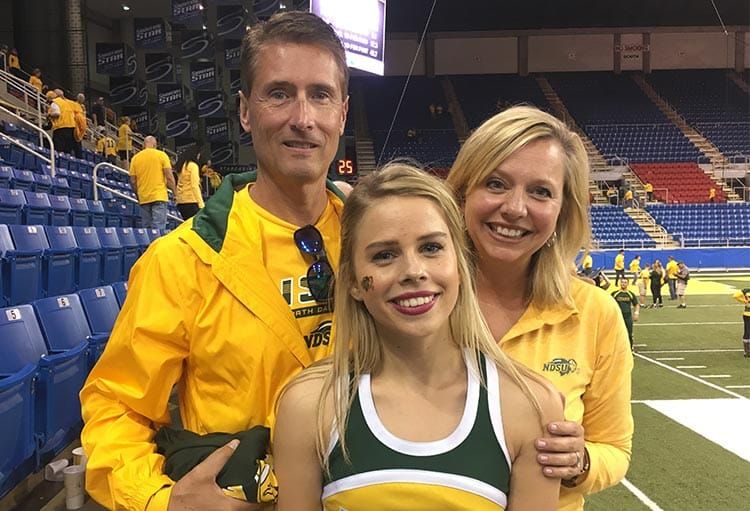 Ellie Helm with parents