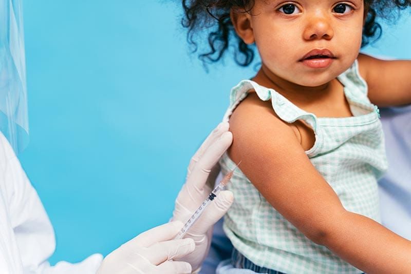 Young child getting vaccine