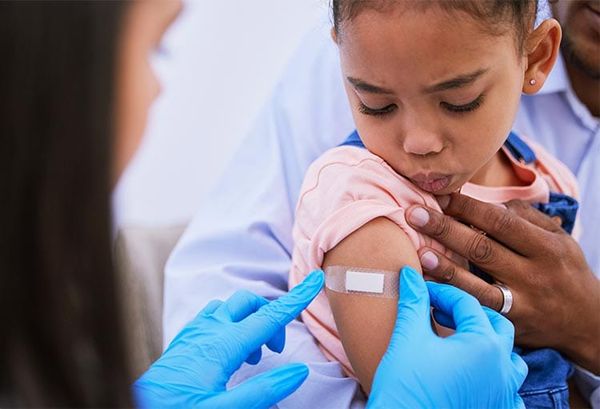 Child getting vaccine shot