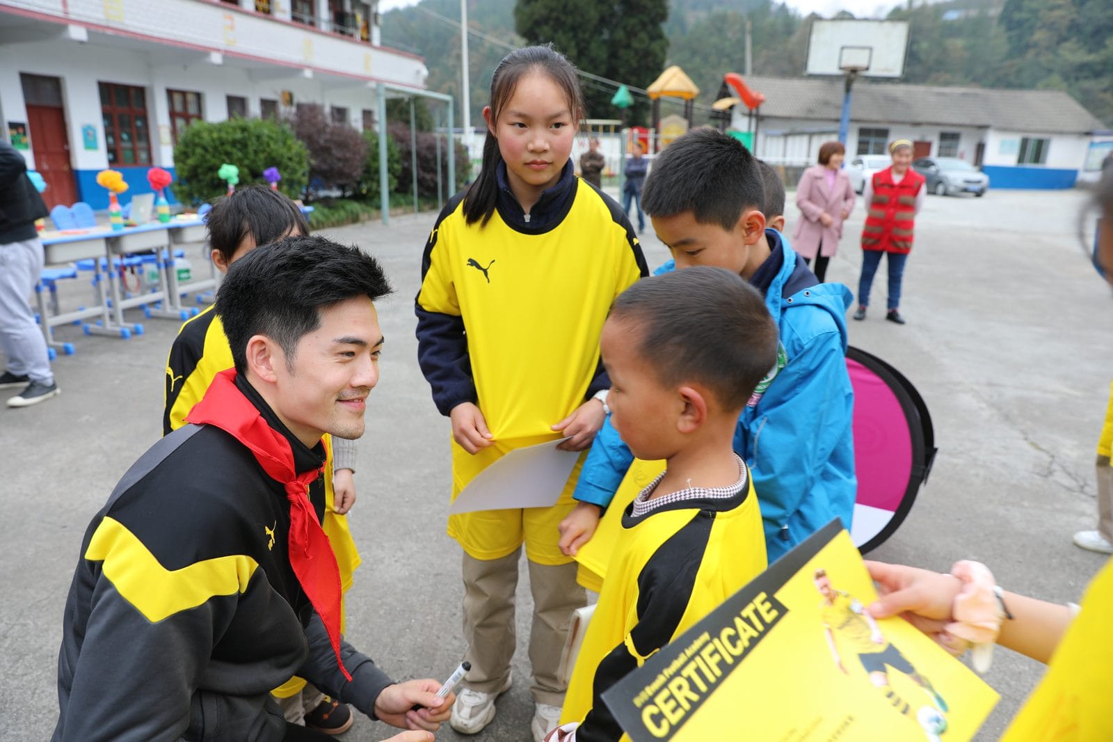 Martin Zhang with young players at a BVB youth football academy in China