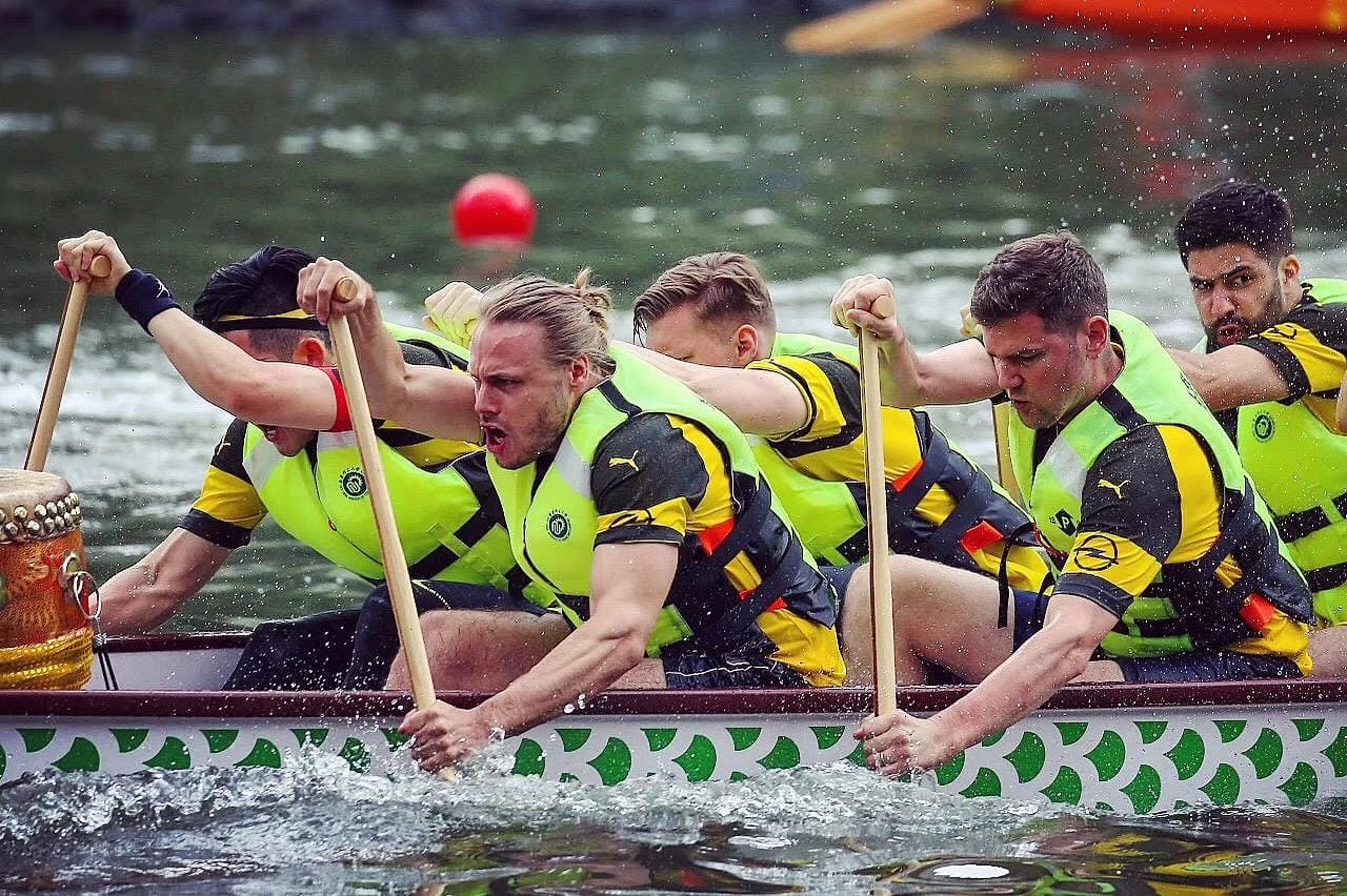 Martin Zhang and his team racing in the Dragon Boat Festival