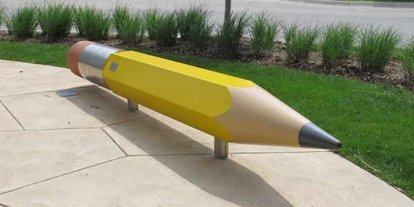 Large pencil shaped bench