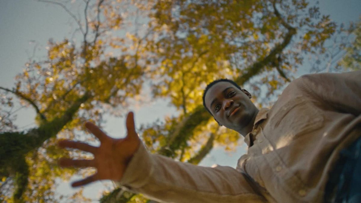 Ethan Herisse looks down at the camera in a still from the film Nickel Boys