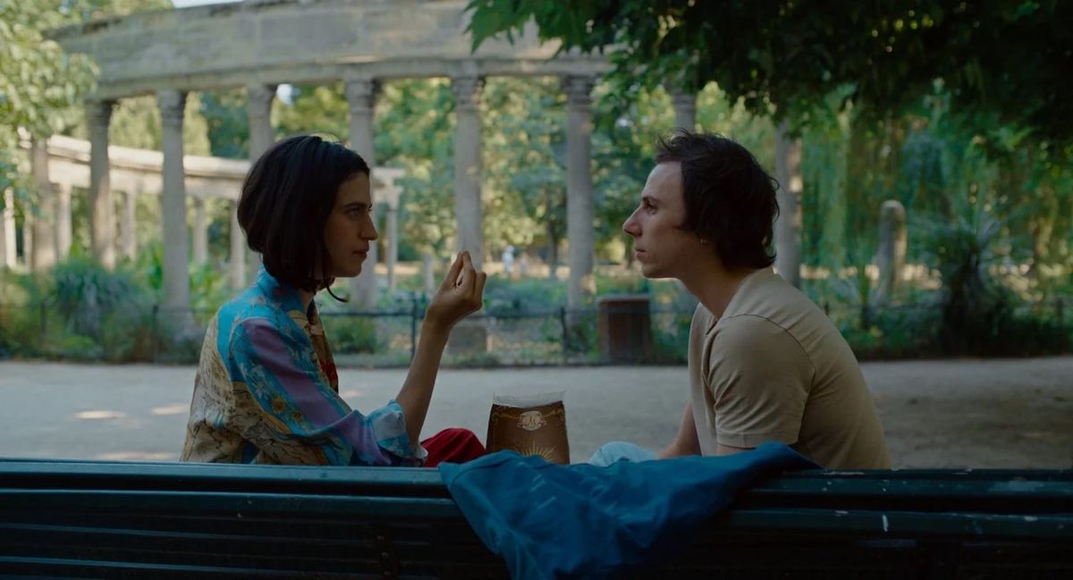 A still from the film Paul and Paulette take a bath, with Marie Benati and Jérémie Galiana talking in a park