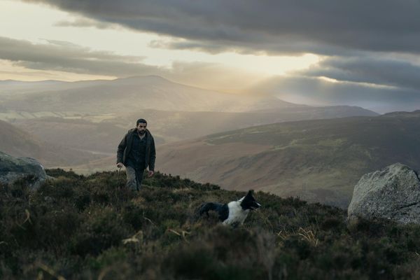 Christopher Abbott walking the hills in a still from the film Bring Them Down
