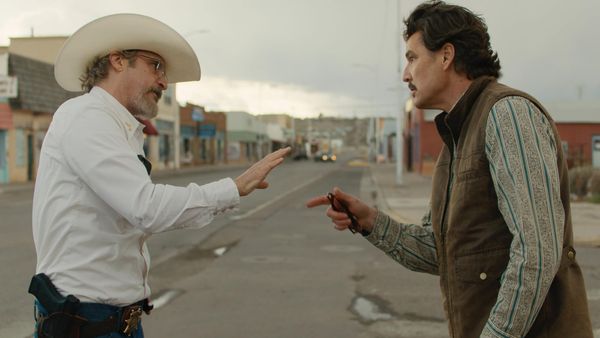 Joaquin Phoenix and Pedro Pascal in conversation in the film Eddington