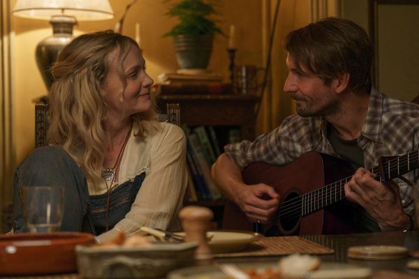 Carey Mulligan and Tom Basden singing at the kitchen table in a still from The Ballad of Wallis Island