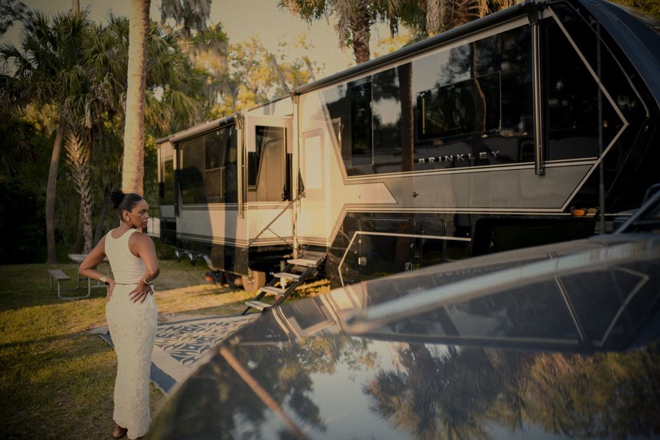 woman in front of a fifth wheel R