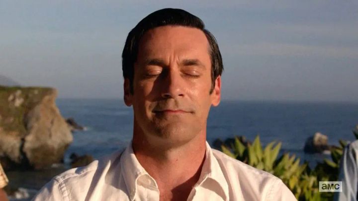 Jon Hamm as Don Draper in the last scene of Mad Men, meditating overlooking the ocean.