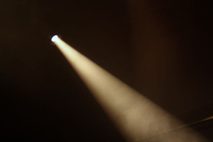 a spotlight against a black background