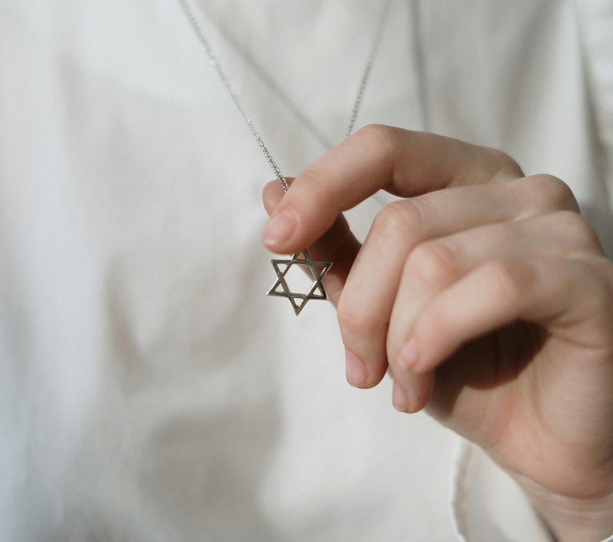 Photo by cottonbro studio: https://www.pexels.com/photo/person-holding-a-star-of-david-4040841/