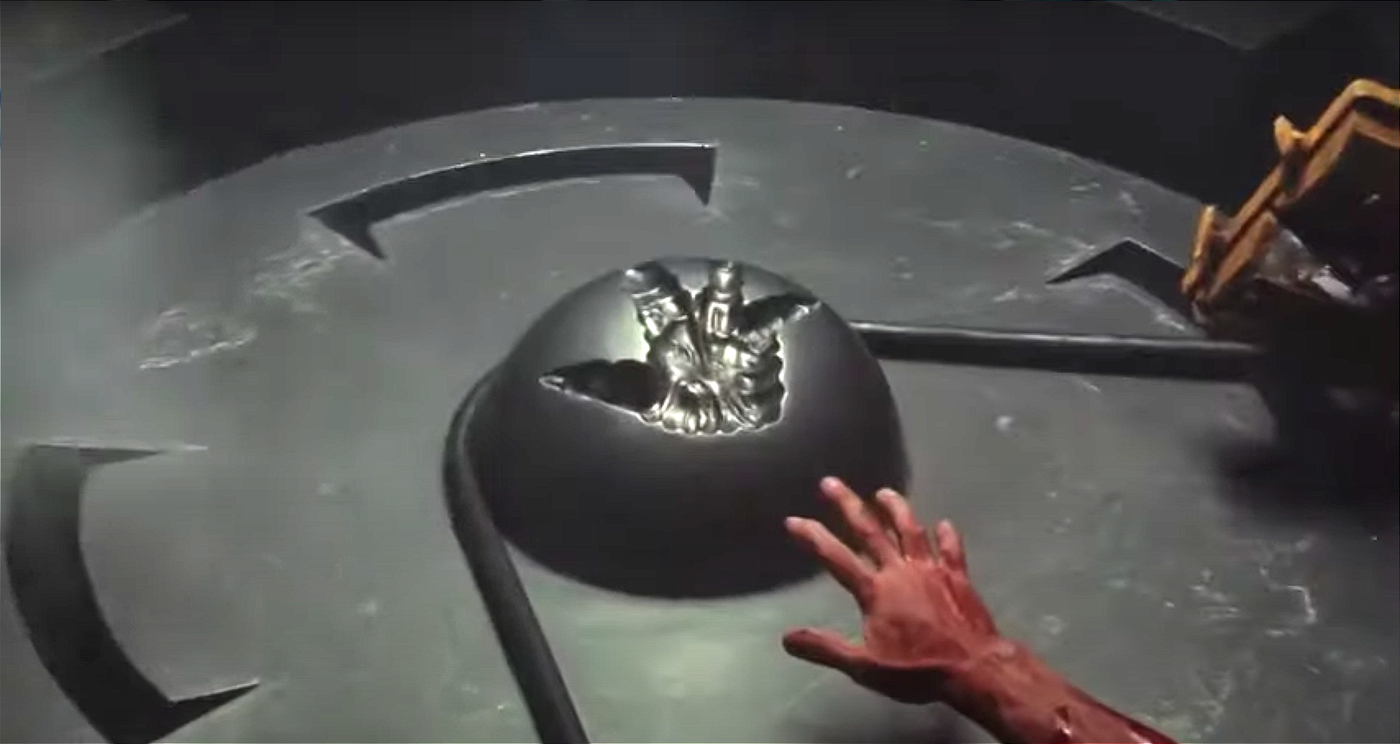 Still from Total Recall (1990) showing Arnold Schwarzenegger’s character on Mars activating alien terraforming machinery—depicted as a dramatic moment where he presses a large control button that triggers the planet’s transformation.