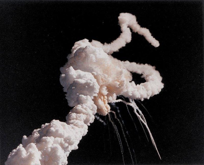 Challenger breaks apart 73 seconds after liftoff, 28 January 1986 — the moment management's "1 in 100,000" met the number nature had been keeping. NASA; source (public domain).